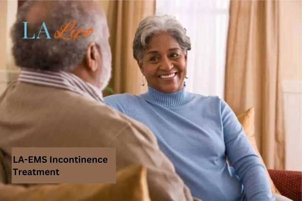 Couple sat smiling at each other - LA-EMS treatment Dorset